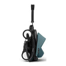Compact Yoyo³ stroller in aqua with a black frame, shown in a folded position for easy transport.