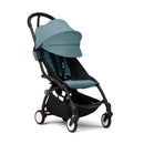 Stokke Yoyo³ stroller with a black frame and aqua color pack, featuring a sun canopy and a compact design.