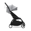 Yoyo³ stroller bundle with a black frame and stone color pack, featuring a sun canopy and compact design.
