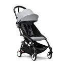 Stokke Yoyo³ stroller bundle with a black frame, featuring a stone color pack and a spacious bassinet.