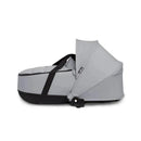 Stokke Yoyo³ stroller bassinet in stone color, featuring a sleek design with a black base and adjustable canopy.