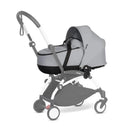 Stokke Yoyo³ stroller bundle featuring a black frame, Stone color pack, and a Stone bassinet attached.