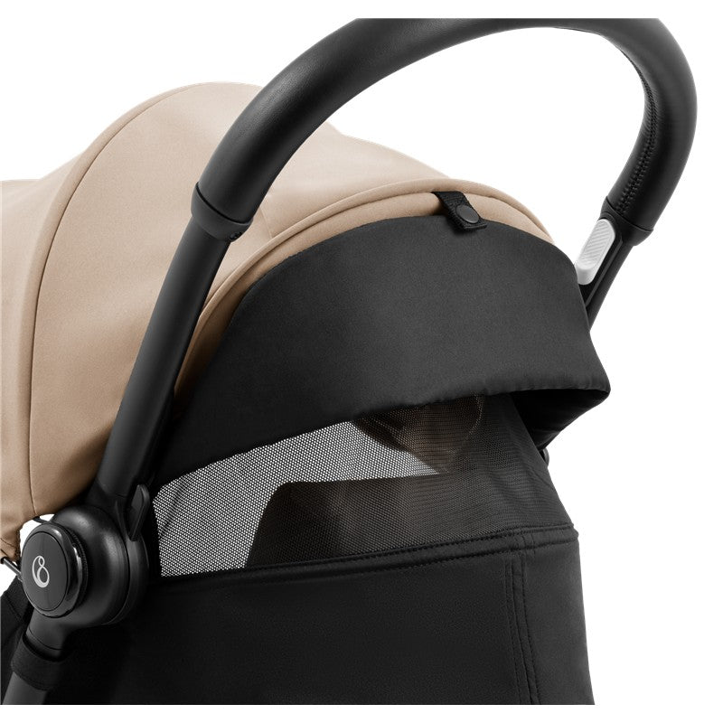 Compact Stokke Yoyo5 stroller featuring a black frame and taupe canopy with mesh visibility panel.