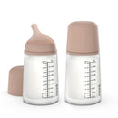 Suavinex 2-pack anti-colic baby bottles, 9 oz, with medium flow nipples and a soft medium tone design.