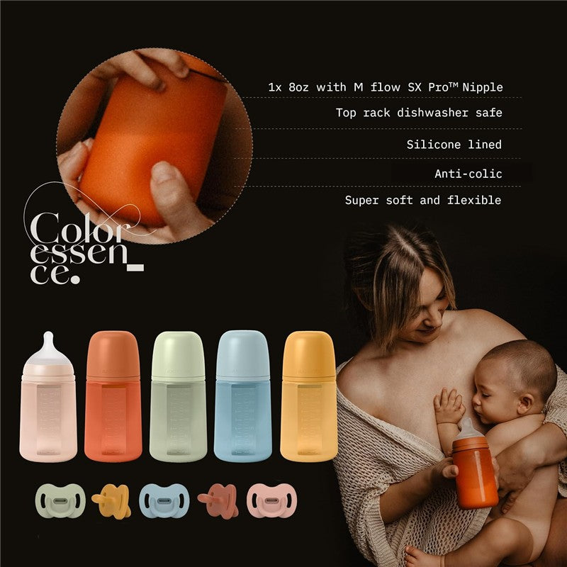 Suavinex Color Essence SX Pro™ Silicone Bottle 8 oz in Irish Cream, held by a mother and baby, with various bottle colors displayed.