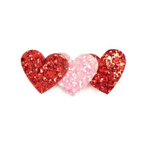 Pink and red glitter hearts clip featuring three glittery heart shapes, two red and one pink, aligned side by side.