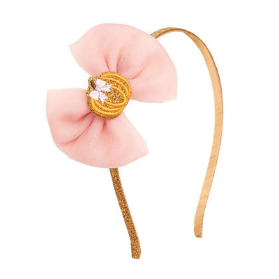 Pumpkin tulle bow headband with a gold glitter strap and a pink bow, featuring a pumpkin decoration at the center.