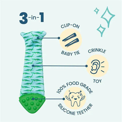 Teething bib tie in seersucker fabric featuring a green alligator pattern, serving as a clip-on baby tie, crinkle toy, and silicone teether.