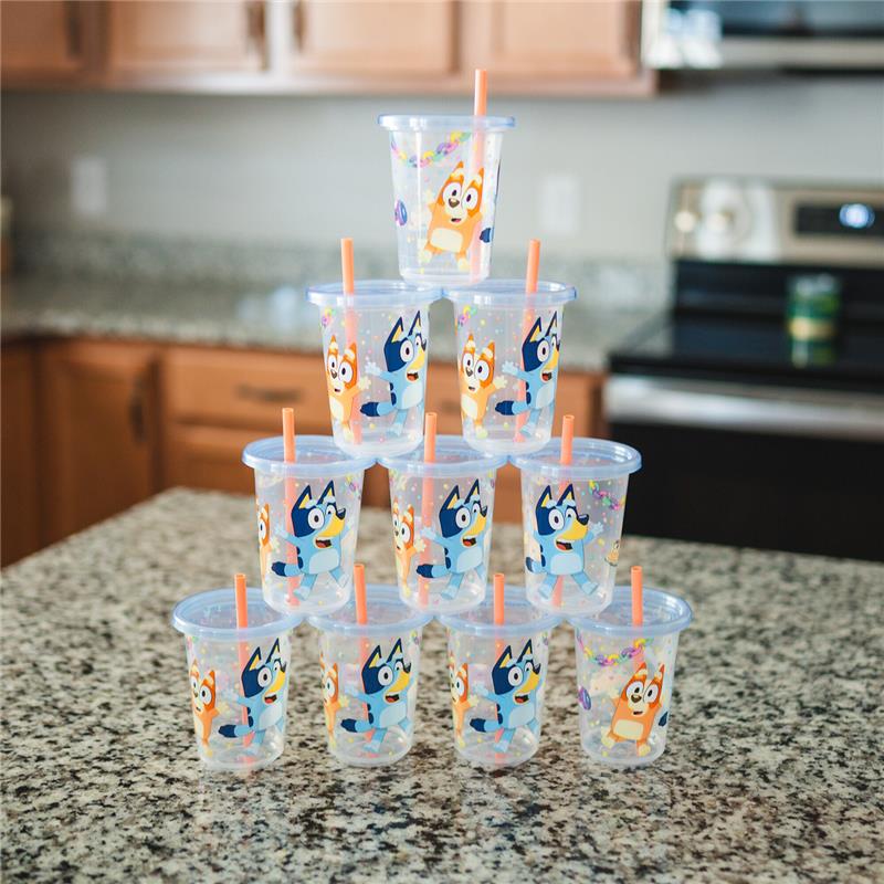Stack of four Bluey Take & Toss Straw Cups featuring colorful cartoon character designs on a countertop.