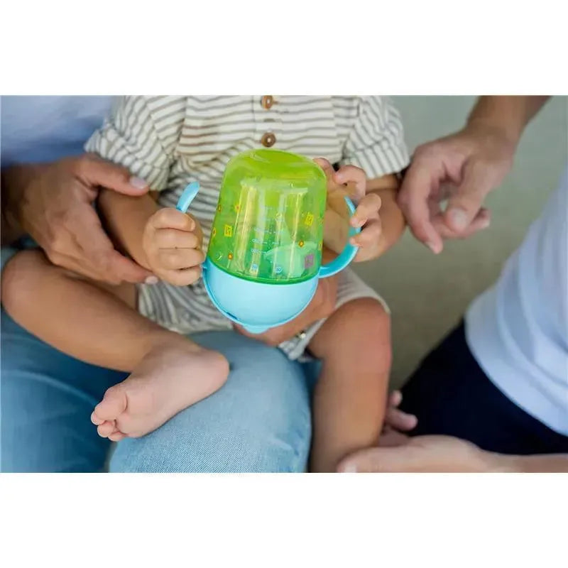 Kids weighted trainer cup designed for toddlers, featuring a green lid with playful patterns and easy grip handles.