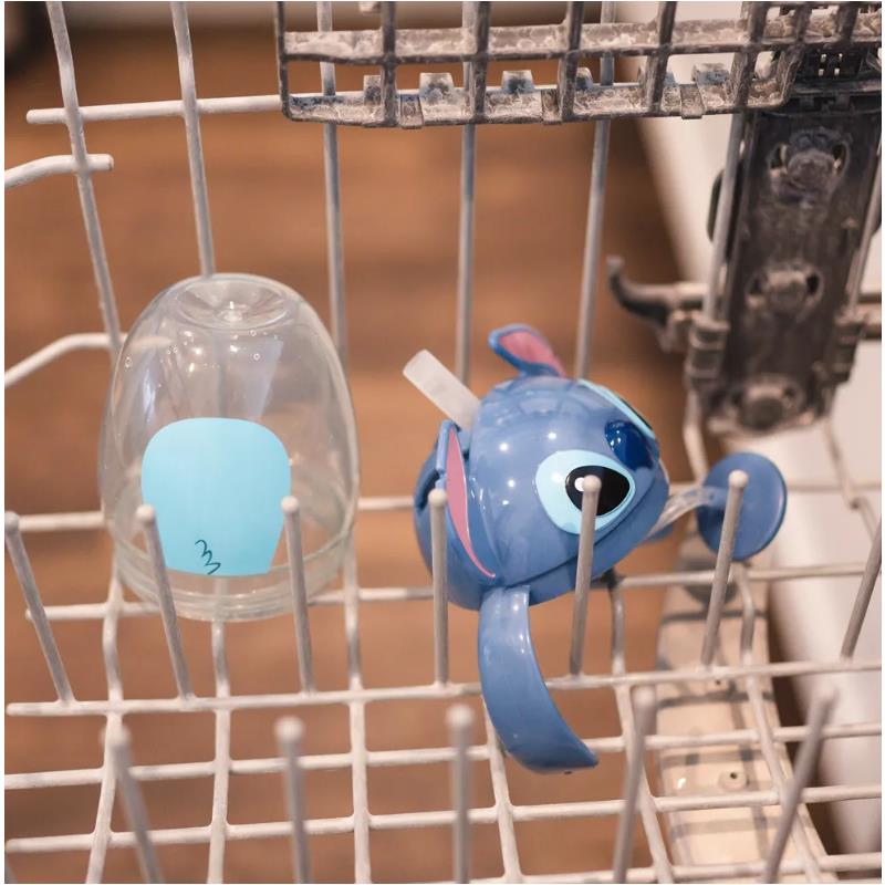 Disney Stitch weighted straw trainer cup in a dishwasher rack, alongside a clear cup with a blue sticker.