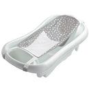 3-in-1 baby bathtub with a white exterior and a gray, polka-dotted mesh sling for infants.