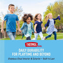 Kids running together in a park, one holding a purple THERMOS FUNTAINER 16oz vacuum insulated bottle.
