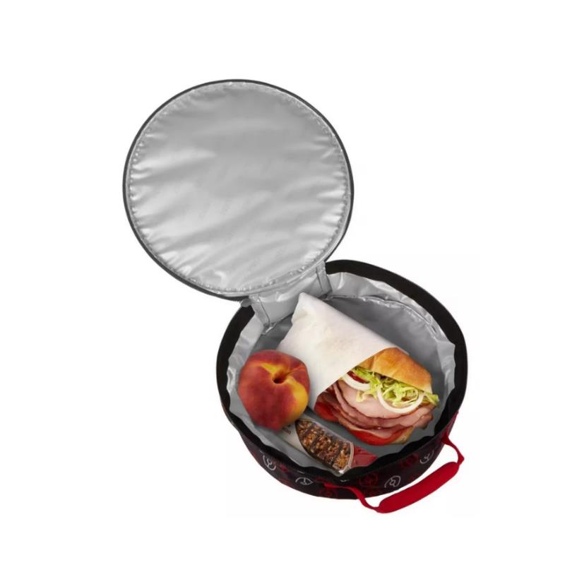 Soft lunch box featuring a Pokémon design, open with a sandwich, a peach, and a granola bar inside.