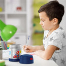 Thermos FUNtainer 10 oz food jar featuring Mario Kart design, next to a boy writing at a desk with a green lamp.