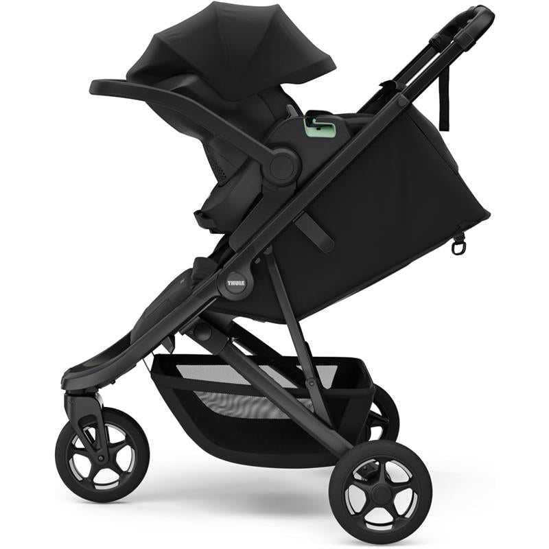 Compact Thule Spring 2 All-Terrain Stroller in black, featuring a spacious seat, adjustable canopy, and large wheels for easy maneuvering.