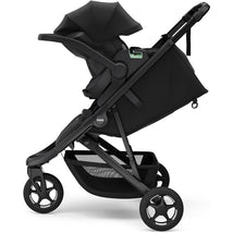 Compact Thule Spring 2 All-Terrain Stroller in black, featuring a spacious seat, adjustable canopy, and large wheels for easy maneuvering.