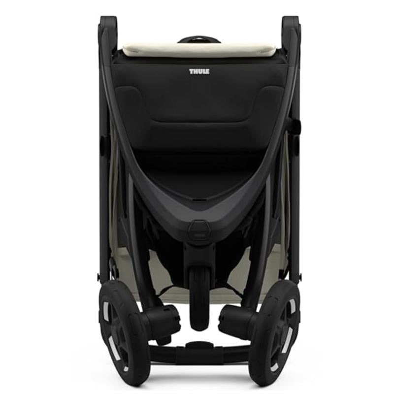 Thule Spring 2 Single Child Stroller in soft beige and black, showcasing a modern design and spacious seating.