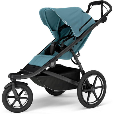 Thule Urban Glide 3 single child all-terrain stroller in blue, featuring a large canopy and sleek black frame.