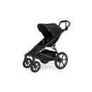 Thule Urban Glide 4-Wheel Single Child All-Terrain Stroller in soft beige, featuring a spacious seat, adjustable canopy, and sturdy wheels.
