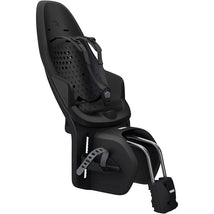 Thule Yepp 2 Maxi Frame Mount in Midnight Black, designed for safe child transport on bicycles, featuring adjustable harness and sturdy frame.