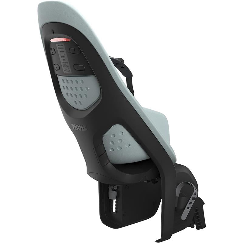 Thule Yepp 2 Maxi Rack Mount child bike seat in light blue and black, featuring adjustable straps and ventilation holes.