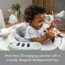 Tiny Love 5-in-1 Here I Grow Activity Center featuring a happy baby playing with soft toys and interactive buttons.