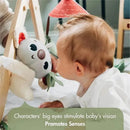 Infant engaging with a soft koala toy on the Tiny Love Boho Chic Gymini Play Mat, promoting sensory development.