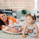 Baby crawls on a Tiny Love Boho Chic Gymini Play Mat while a woman encourages her, showcasing colorful detachable toys.