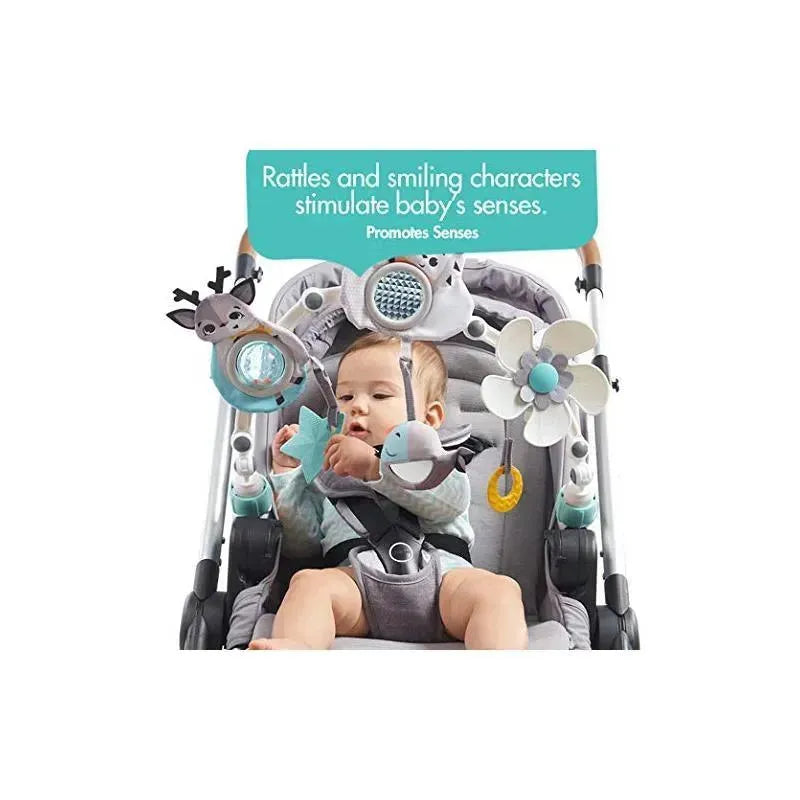 Tiny Love Magical Tales Black & White Stroller Arch with playful toys stimulating a baby in a stroller.