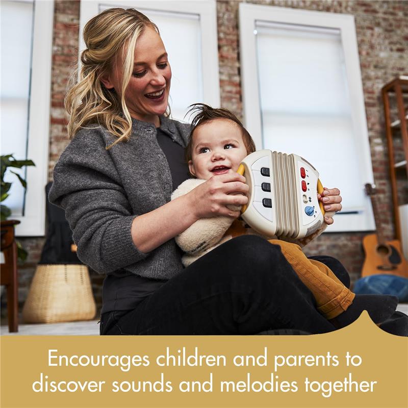 A mother and child enjoy the Tiny Love Accordion Toy, fostering musical exploration together.