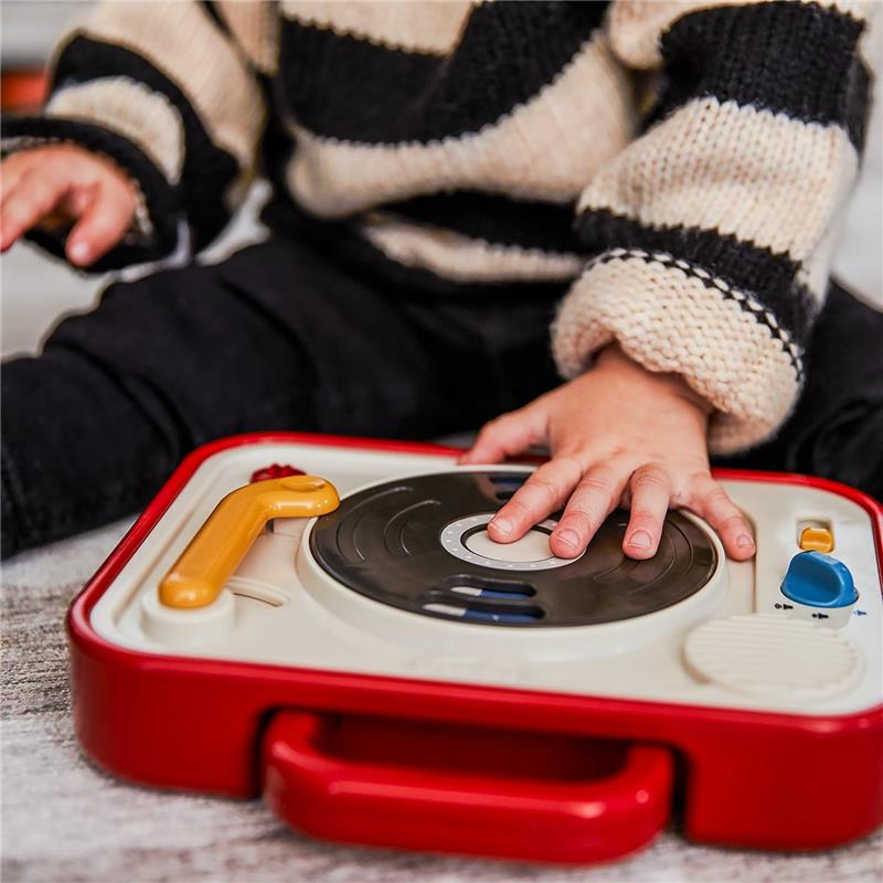 Tiny Love Tiny Rockers Dj Station Toy with a child’s hand interacting with the spinning record player.