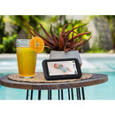 AI Smart Baby Monitor displaying a sleeping baby, next to a refreshing drink and a potted plant, by a poolside.