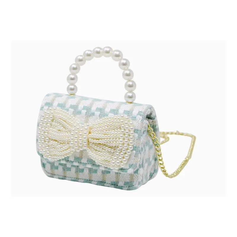 Tweed purse in blue with a pearl handle and a large pearl bow detail, perfect for tiny treats or accessories.