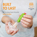 Boon CACTI Replacement Brush Set in green, featuring a durable brush with nylon bristles, held above a funnel.