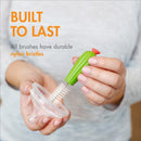 Boon CACTI Bottle Cleaning Brush with durable nylon bristles, being used on a bottle top by a person.