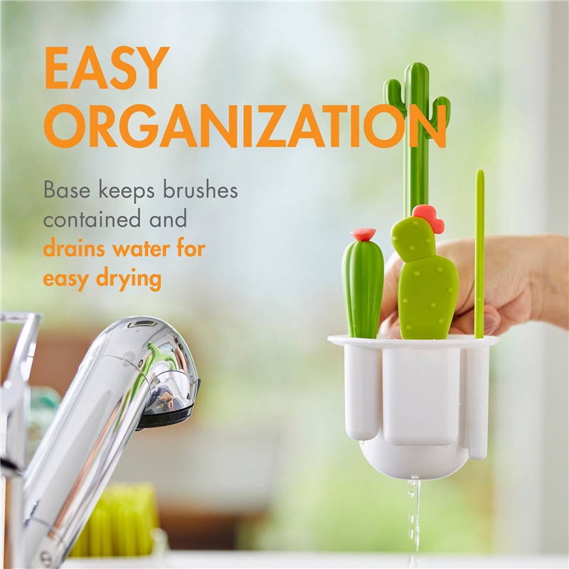 Boon CACTI Bottle Cleaning Brush Set in a white holder with cactus-shaped brushes, promoting easy organization and water drainage.