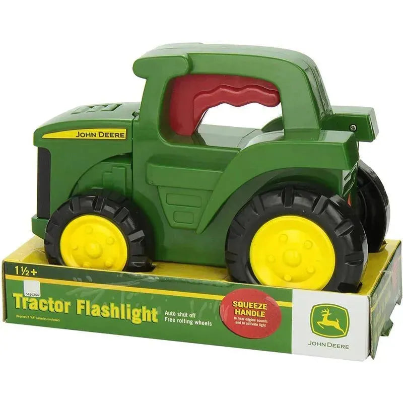 Tomy John Deere Roll N Go Flashlight, a green tractor-shaped toy with rolling wheels and a squeeze handle to activate light.