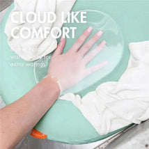Puff Inflatable Bather in mint green, with a hand resting on it, showcasing comfort and warmth features.