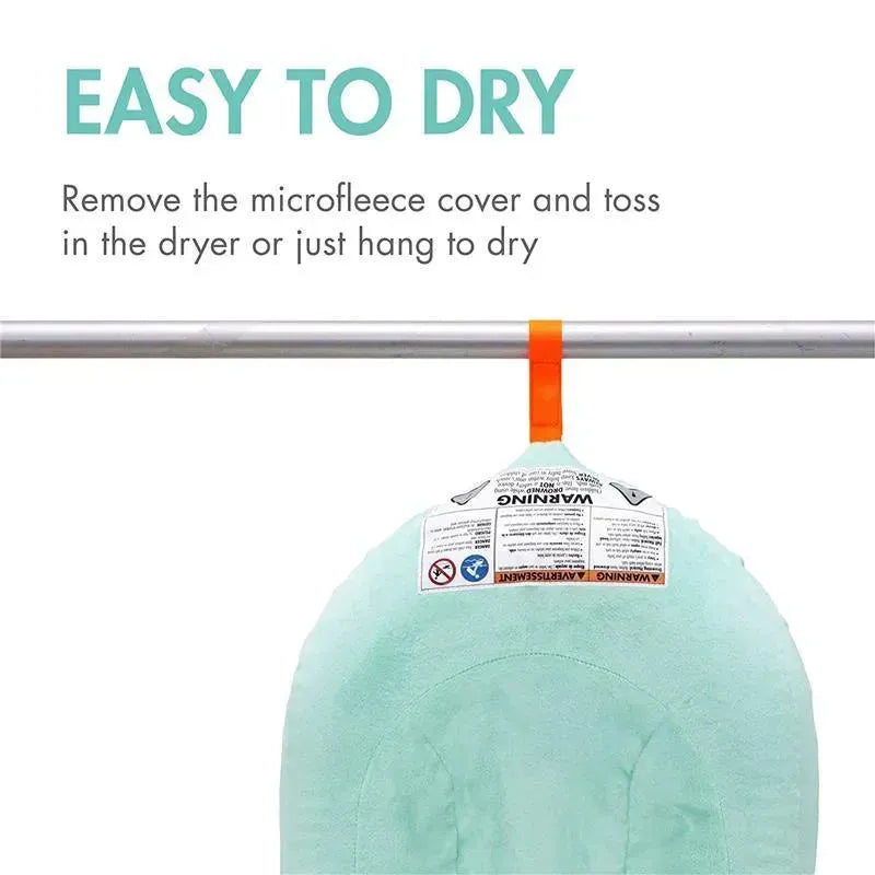 Puff Inflatable Bather by Tomy, featuring a mint green microfleece cover; includes drying instructions and warning labels.