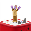 Tonies Doggyland Audio Toy Figurine, a playful purple dog with arms raised, atop a red audio box with two gray fins.