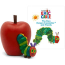 Tonies The Very Hungry Caterpillar figurine next to a red apple and book cover featuring colorful illustrations.