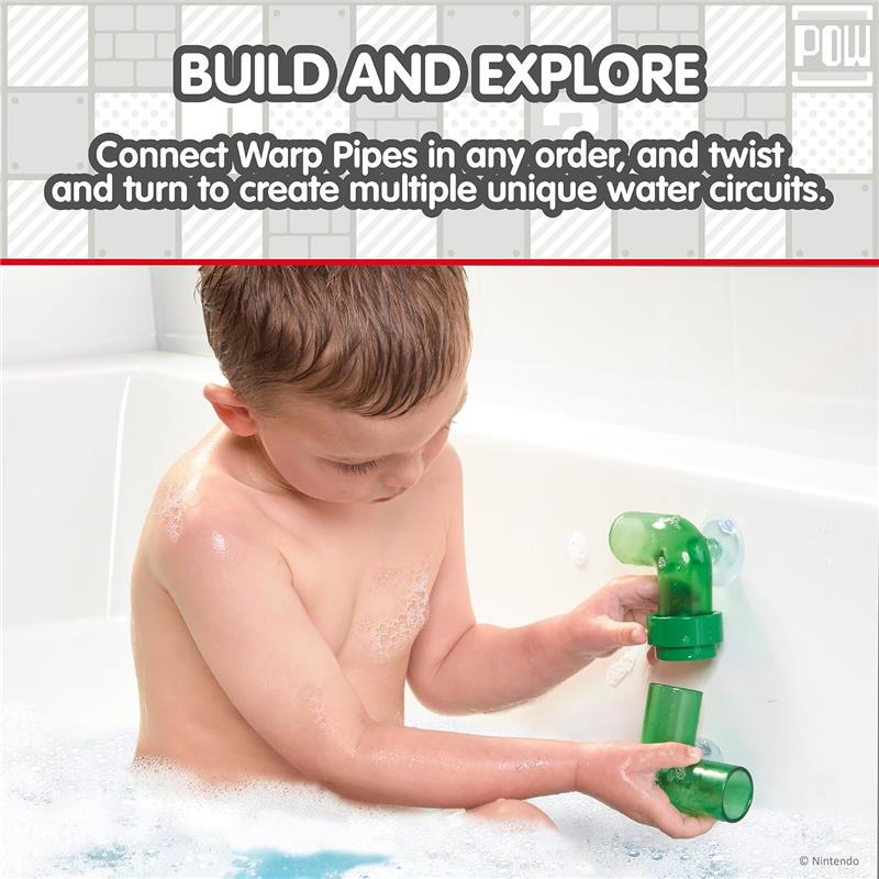 Child playing with Toomies My Mario Bath Pipes Playset, connecting green warp pipes in a bubble-filled bath.
