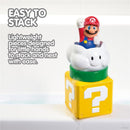 Toomies My Mario Pour & Nest Bath Toy features a Mario character atop a cloud, resting on a question mark block, with bubbly water surrounding.