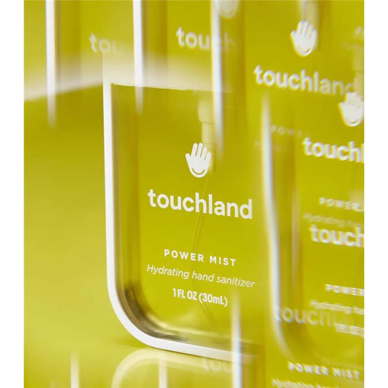 Touchland Vanilla Blossom Power Mist Hydrating Hand Sanitizer in a clear bottle with bright yellow background.