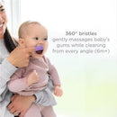 Baby smiles while using a purple Ubbi silicone finger toothbrush; text highlights 360° bristles for gum cleaning.