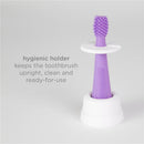 Training toothbrush set with a purple brush and hygienic holder for keeping it clean and upright.