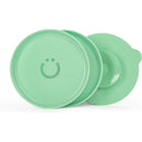 Set of two green Ubbi plates with interchangeable suction bases, featuring a smiley face design on each plate.