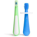 Two toddler toothbrushes in green and blue. The green brush has soft bristles, and the blue brush features a textured head.