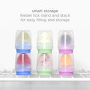 Ubbi Smoothie Purple Baby Food Feeder Set with stackable, colorful feeding containers on a shelf, showcasing smart storage.